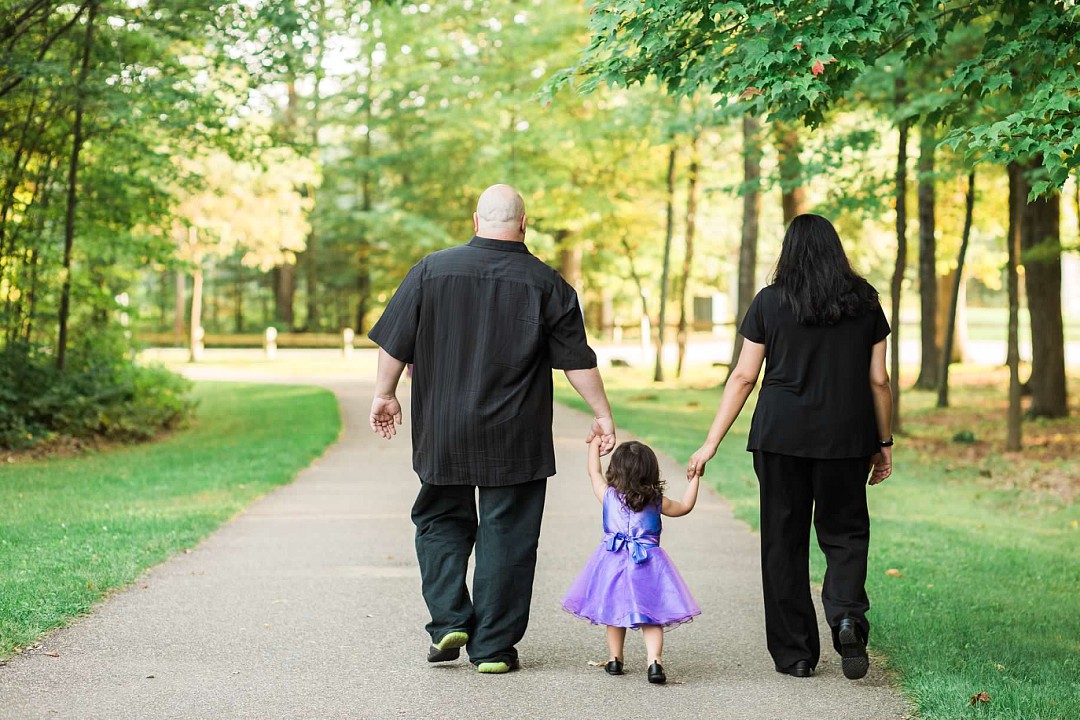 image of family walking into woods